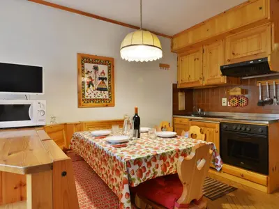 a kitchen with a table with a table cloth at Apartment Apt 1 by Interhome in Penia