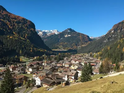 a small town in a valley in the mountains at Apartment Marmolada-12 by Interhome in Alba di Canazei