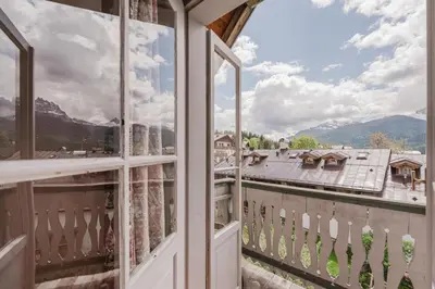 a balcony with a view of the mountains at Ca' Alpini - Mountain View Terrace & Parking in Cortina dʼAmpezzo
