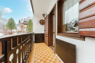 a balcony with a door and a window at Sasso Bianco Home - Mountain View & Private Parking in Sottoguda
