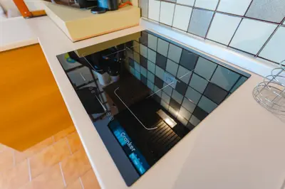 a view from above of a kitchen counter with a dishwasher at Sasso Bianco Home - Mountain View & Private Parking in Sottoguda