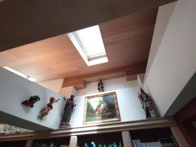 a room with some statues on a shelf at Cortina Olympics cosy apartment in Cortina dʼAmpezzo