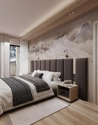 a bedroom with a large bed and a painting on the wall at Mountain Chalet Costes in San Cassiano