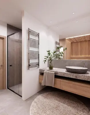 a bathroom with a sink and a glass shower at Mountain Chalet Costes in San Cassiano