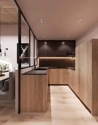 a kitchen with black cabinets and wooden counters at Mountain Chalet Costes in San Cassiano