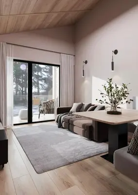 a living room with a bed and a table at Mountain Chalet Costes in San Cassiano