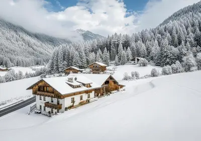 an aerial view of a house in the mountains at Wieserhof Vals in Valles