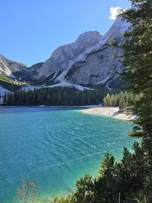 a view of a lake with mountains in the background at Aparthotel Carbonin in Dobbiaco