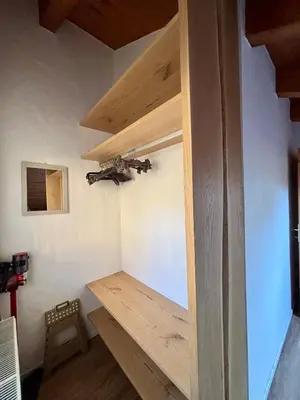 a room with a wooden desk in a room at Pragma Apartments - Sky Lodge Bellamonte in Bellamonte