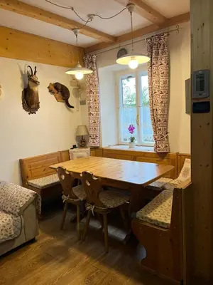 a dining room with a wooden table and chairs at Casa Gabry by Sunhome Fiemme in Varena