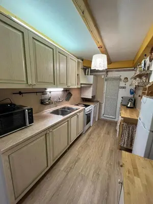 a kitchen with a sink and a microwave at Casa Gabry by Sunhome Fiemme in Varena