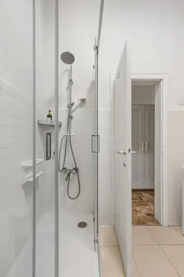 a shower with a glass door in a bathroom at Lauben Apartment II Bolzano in Bolzano