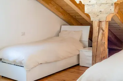 a bathroom with a shower and a sink and a washing machine at Un Sogno Tra Le Dolomiti in Frena