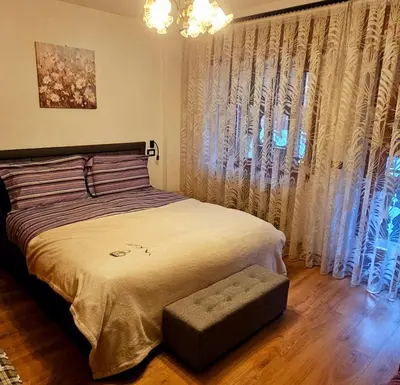 a bedroom with a bed and a window with curtains at Cesira in Mareson