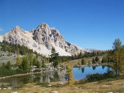 a view of a mountain with a lake in the foreground at Appartamenti Chantal in San Martino in Badia