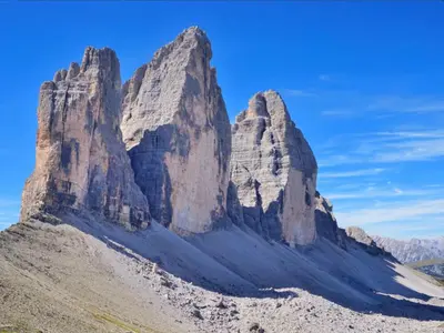 a mountain in the desert with a blue sky at Appartamenti Chantal in San Martino in Badia