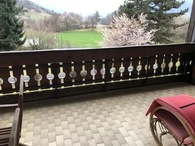 a fence with a bunch of clocks on it at Casa dolce casa in Vols am Schlern
