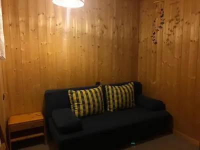 a black couch with two pillows in a room at Casa dolce casa in Vols am Schlern