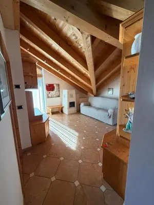 a bathroom with two sinks and a toilet and a shower at Casa Lilla Predazzo in Predazzo
