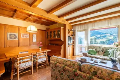 a living room with a couch and a table at Ca dei Castori in Cortina dʼAmpezzo