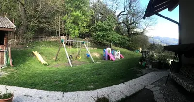 a yard with children playing on a playground at Gasserhof Aicha in Naz-Sciaves