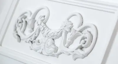 a white heart shaped decoration on a white wall at Park Residence Apartments in Bolzano