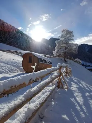 a small wooden boat sitting on a pile of rocks at Hanselerhof in Val di Mezzo