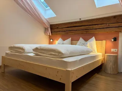 a living room and kitchen with a couch and a table at Hanselerhof in Val di Mezzo