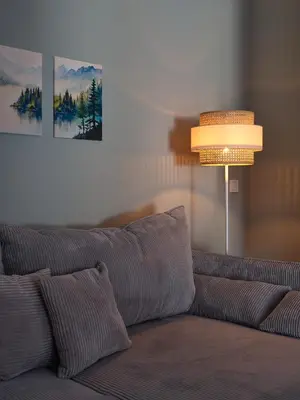 a living room with a couch and a lamp at LIMIX Stays in Appiano sulla Strada del Vino