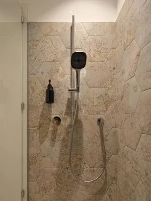a shower in a bathroom with a glass door at LIMIX Stays in Appiano sulla Strada del Vino