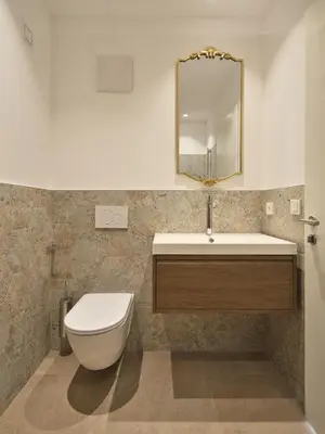 a bathroom with a toilet and a sink and a mirror at LIMIX Stays in Appiano sulla Strada del Vino