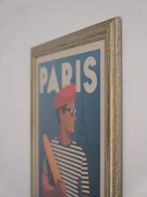 a framed picture of a man holding a baseball bat at LIMIX Stays in Appiano sulla Strada del Vino