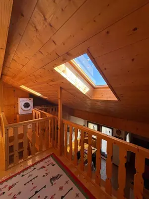 a view from the loft of a cabin with a skylight at Mansarda Veronza in Castello di Fiemme