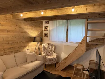 a living room with a couch and a window at Il Tabià