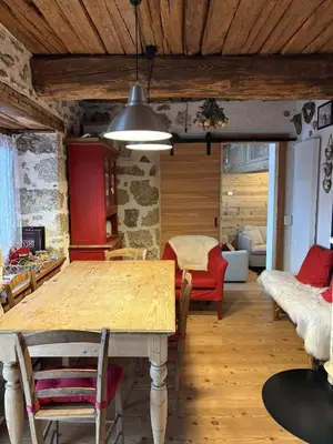 a dining room with a wooden table and chairs at Il Tabià