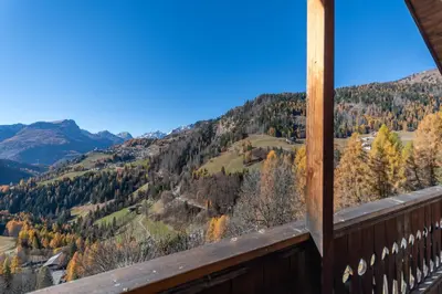 a view from the balcony of a cabin in the mountains at Dreamful Cottage in Selva di Cadore