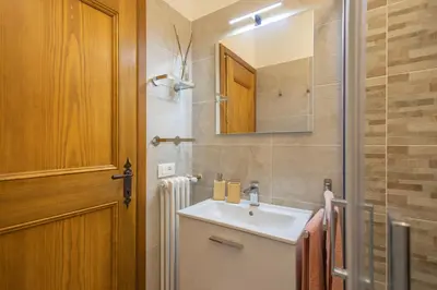 a bathroom with a sink and a mirror at Cortina - Chalet Pocol 22 in Pocol