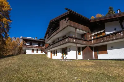 a large house with a yard in front of it at Cortina - Chalet Pocol 22 in Pocol
