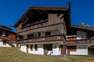 a large building with balconies on the side of it at Cortina - Chalet Pocol 22 in Pocol