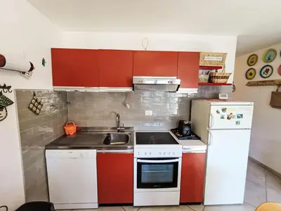 a living room with a table and a couch at Apartment Val Fiemme by Interhome in Cavalese