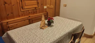 a table with a stuffed animal sitting on top of it at Bella Cortina - comodo al centro e impianti, con garage in Cortina dʼAmpezzo