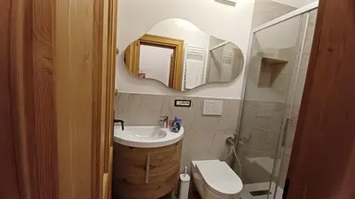 a bathroom with a sink and a mirror at Bella Cortina - comodo al centro e impianti, con garage in Cortina dʼAmpezzo