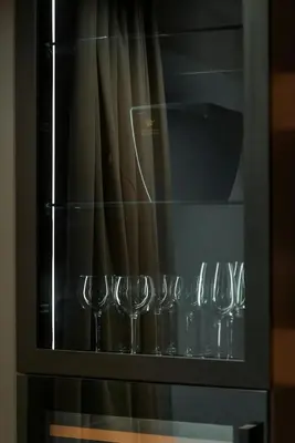 a group of wine glasses sitting in an oven at Cademai Alpenglow Chalet with Sauna R&R in Cortina dʼAmpezzo