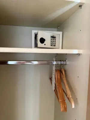 a shelf with a microwave and some baseball bats at Grunen Baum - Vöran in Verano