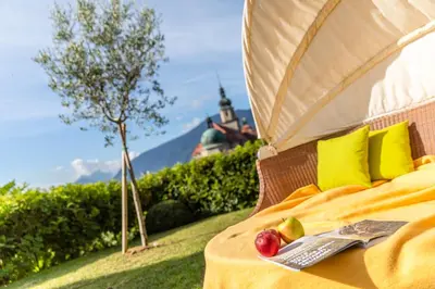 a bed with some fruit on it in a field at Haselgrund in Tirolo