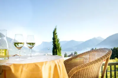 two glasses of white wine sitting on a table at Haselgrund in Tirolo