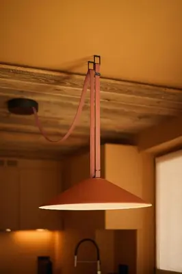 aendant light hanging from the ceiling of a kitchen at Les Pares in Corvara in Badia