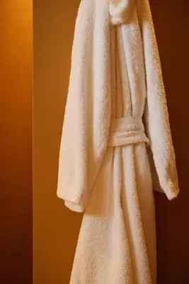 a white towel is hanging on a wall at Les Pares in Corvara in Badia