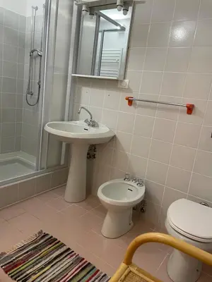 a bathroom with a sink and a toilet and a shower at Monoloclae-Prati di Solaiolo in Solaiolo