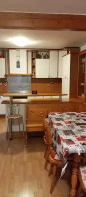 a kitchen with a table with a tablecloth on it at Lili's house in Pera